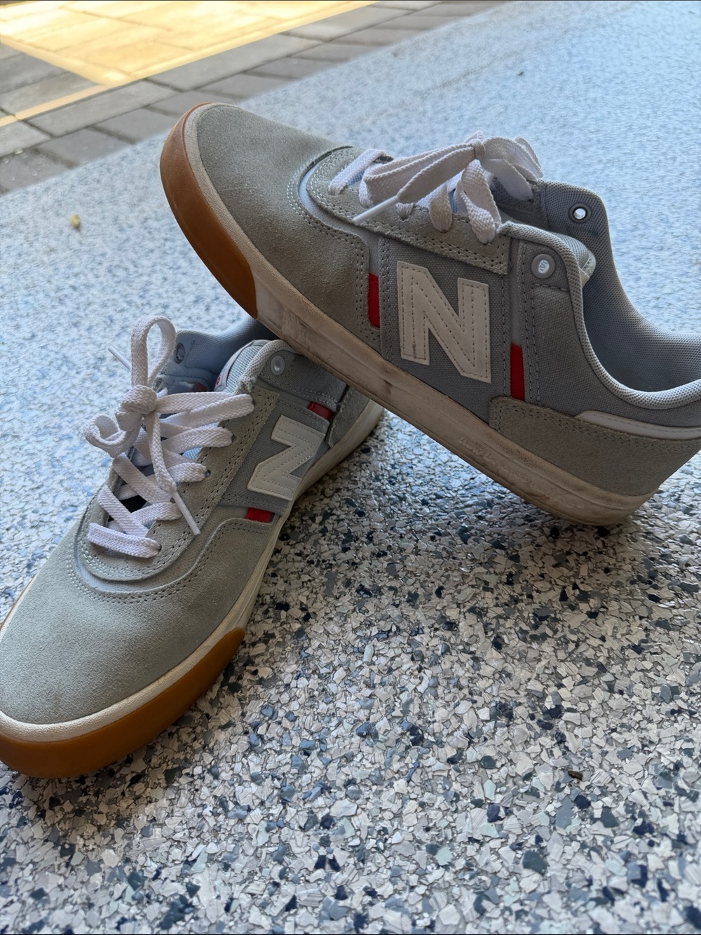 New Balance Men's Light Gray Suede Sneakers with Gum Sole and Red Accents